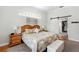 Main bedroom features a sliding barn door to the closet and a decorative headboard at 9830 Caribou Trl, Dade City, FL 33525