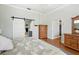 Main bedroom features barn door to bathroom and convenient access to the kitchen at 9830 Caribou Trl, Dade City, FL 33525