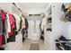 Spacious walk-in closet with custom shelving, drawers, and ample storage space at 9830 Caribou Trl, Dade City, FL 33525