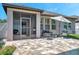 Enjoy the tiled back porch with its comfortable seating and screened-in area for relaxing outdoor living at 11314 American Holly Dr, Riverview, FL 33578