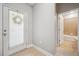 Bright entryway with tile floors, door to the outside and bathroom at 11314 American Holly Dr, Riverview, FL 33578
