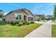 Beautiful home with stone accents and well-manicured landscaping, enhancing its curb appeal at 11314 American Holly Dr, Riverview, FL 33578