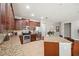 An open kitchen with stainless steel appliances, granite countertops, and lots of storage at 11314 American Holly Dr, Riverview, FL 33578