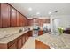 This spacious kitchen features granite countertops, stainless appliances, and ample cabinet space at 11314 American Holly Dr, Riverview, FL 33578