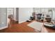 This office features wood floors, a desk, a comfortable chair, and a neutral color palette at 11314 American Holly Dr, Riverview, FL 33578