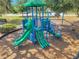 Community playground featuring a slide and climbing structure for recreational fun at 11314 American Holly Dr, Riverview, FL 33578