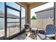 Cozy screened porch with a grill and chair, perfect for outdoor cooking and relaxation in a bug-free environment at 11314 American Holly Dr, Riverview, FL 33578