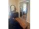 Bedroom with natural light and a mirrored closet next to the vintage dresser at 11814 Washington St, Seffner, FL 33584