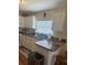 Kitchen with white cabinets, sleek countertops, and updated appliances at 11814 Washington St, Seffner, FL 33584