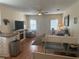 Cozy living room with wood floors, comfortable seating, and a flatscreen tv at 11814 Washington St, Seffner, FL 33584