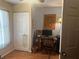 Home office with a wooden desk, computer, and natural light at 11814 Washington St, Seffner, FL 33584