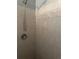 Tiled shower with handheld shower head and neutral colored square tiled surround at 11814 Washington St, Seffner, FL 33584