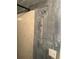 Updated shower with wooden panels and off-white tiles, complete with a shower head and hooks at 11814 Washington St, Seffner, FL 33584