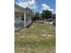 Wide view of home's fenced yard with chain link fence at 11814 Washington St, Seffner, FL 33584