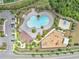 Aerial view of community pool with lounge area, basketball court, playground, and parking at 11847 Brighton Knoll Loop, Riverview, FL 33579