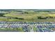 Aerial view of a residential neighborhood adjacent to vast open green space at 11847 Brighton Knoll Loop, Riverview, FL 33579