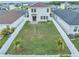 Wide aerial perspective of a generous backyard, bordered by a neat privacy fence at 11847 Brighton Knoll Loop, Riverview, FL 33579