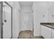 The bathroom includes a glass shower stall, toilet, door, and a sink with a dark countertop at 11847 Brighton Knoll Loop, Riverview, FL 33579