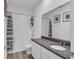 Bright bathroom features a shower-tub combo, white cabinets, and a gray countertop vanity at 11847 Brighton Knoll Loop, Riverview, FL 33579