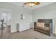 Light and airy Bedroom with a wooden crib, white dresser, and neutral color palette at 11847 Brighton Knoll Loop, Riverview, FL 33579