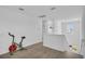 Upstairs bonus room with wood floors, bright light, and recreational equipment at 11847 Brighton Knoll Loop, Riverview, FL 33579