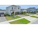 Attractive home with a well-maintained lawn and a paved driveway in a suburban neighborhood at 11847 Brighton Knoll Loop, Riverview, FL 33579