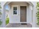 Inviting entryway with a decorative front door, brick pavers, and architectural details at 11847 Brighton Knoll Loop, Riverview, FL 33579