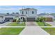 Beautiful home featuring manicured landscaping, a paved driveway, and a two-car garage at 11847 Brighton Knoll Loop, Riverview, FL 33579