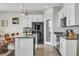 Modern kitchen with island, stainless appliances, breakfast bar, and open to the living area at 11847 Brighton Knoll Loop, Riverview, FL 33579