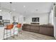 Open-concept living space featuring stylish floors, and a comfortable leather sofa at 11847 Brighton Knoll Loop, Riverview, FL 33579