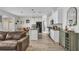 Bright and airy kitchen open to living room, featuring modern finishes and great flow at 11847 Brighton Knoll Loop, Riverview, FL 33579
