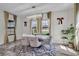 This dining room features modern lighting, neutral decor, and large windows at 12650 Shetland Walk Dr, Lithia, FL 33547