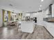 Beautiful kitchen with a large center island, modern appliances, and an adjacent dining area at 12650 Shetland Walk Dr, Lithia, FL 33547