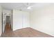 Bedroom with wood-look tile floors, a closet, and a ceiling fan at 13046 Leverington St, Tampa, FL 33624
