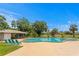 Community pool featuring multiple beach chairs, a covered area and lots of space for gatherings at 13046 Leverington St, Tampa, FL 33624