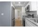 Updated kitchen featuring stainless steel appliances and granite countertops at 13046 Leverington St, Tampa, FL 33624