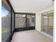 Screened patio with backyard view at 13046 Leverington St, Tampa, FL 33624