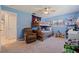 Another view of the ' bedroom with a bunk bed, blue walls, and comfortable seating at 13168 84Th Ter, Seminole, FL 33776