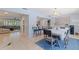 Spacious dining room offers seamless access to living spaces and features a view of the comfortable living room at 13168 84Th Ter, Seminole, FL 33776