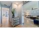Hallway featuring coastal-inspired decor, with a view into the spacious living area at 13168 84Th Ter, Seminole, FL 33776