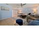 Cozy living room with a sectional sofa, stylish decor, and ample natural light, creating a comfortable gathering space at 13168 84Th Ter, Seminole, FL 33776