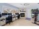 Bright office featuring dual desks, a cozy fireplace, and ample natural light at 13168 84Th Ter, Seminole, FL 33776