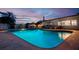 Sparkling pool with inviting lounge area, perfect for relaxing and entertaining in a private backyard setting at 13168 84Th Ter, Seminole, FL 33776