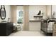 Stylish Bedroom with a crib, dresser, rocking chair, and decorative accents at 14965 Topaz Blue St, Wimauma, FL 33598