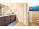This bathroom features granite countertops, double sinks, and access to the toilet at 15207 Taralane Ave, Brooksville, FL 34604