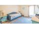 Bright bedroom with a daybed, turquoise accents, and playful wall decor at 15207 Taralane Ave, Brooksville, FL 34604