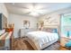 Bright bedroom with decorative wall art and a large window at 15207 Taralane Ave, Brooksville, FL 34604
