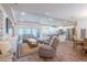 Comfortable living room with hardwood floors seamlessly connecting to the modern kitchen, perfect for entertaining at 15207 Taralane Ave, Brooksville, FL 34604