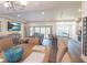 Open concept living area featuring a seamless transition between the dining room, living room, and modern kitchen at 15207 Taralane Ave, Brooksville, FL 34604