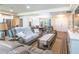Bright and airy living room featuring hardwood floors, neutral tones, and an inviting atmosphere, perfect for relaxation at 15207 Taralane Ave, Brooksville, FL 34604